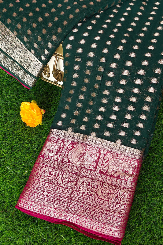 Green saree with Rani Pink border and Rani Pink pallu
