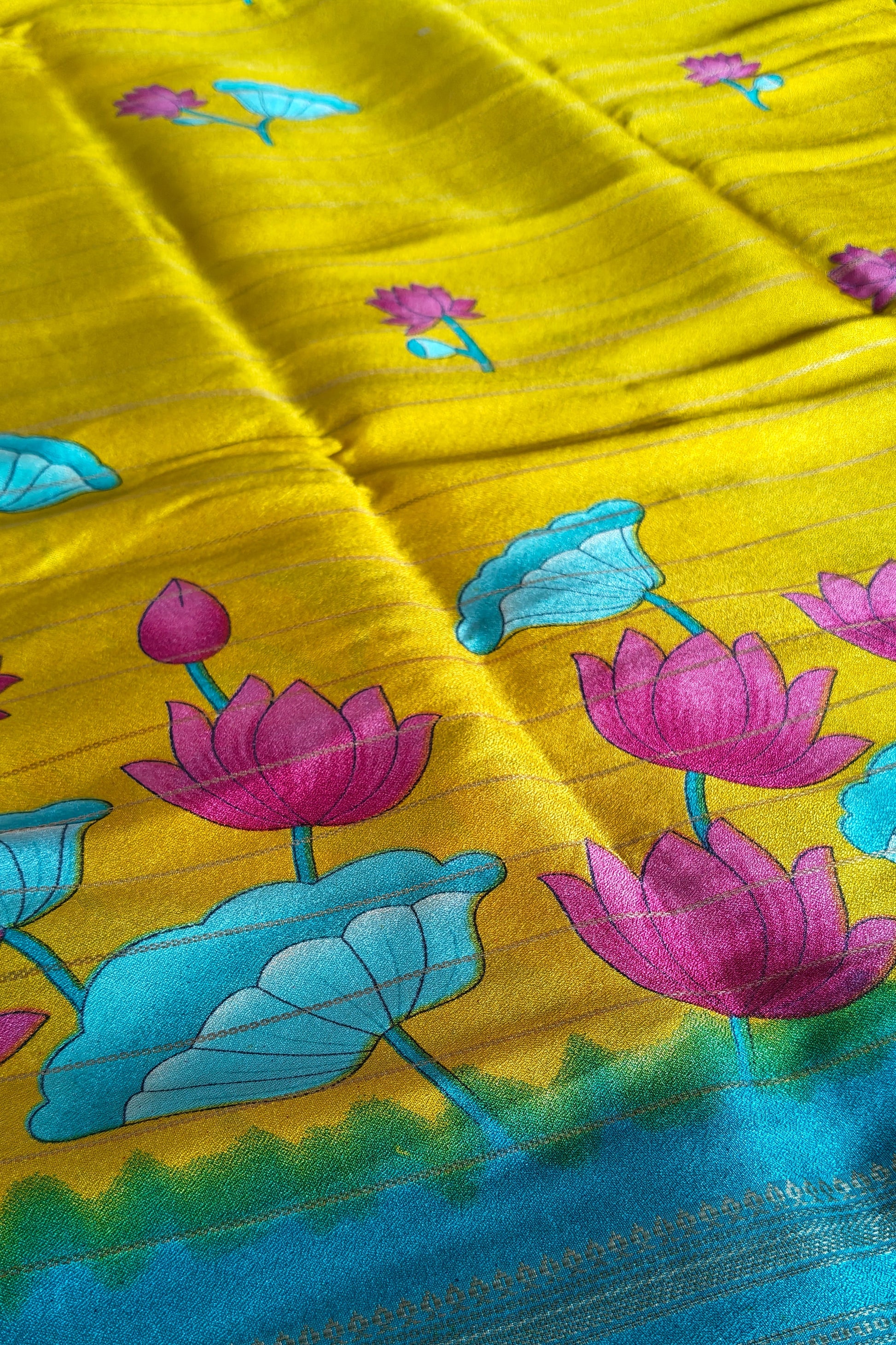 Yellow saree with colorful floral patterns

