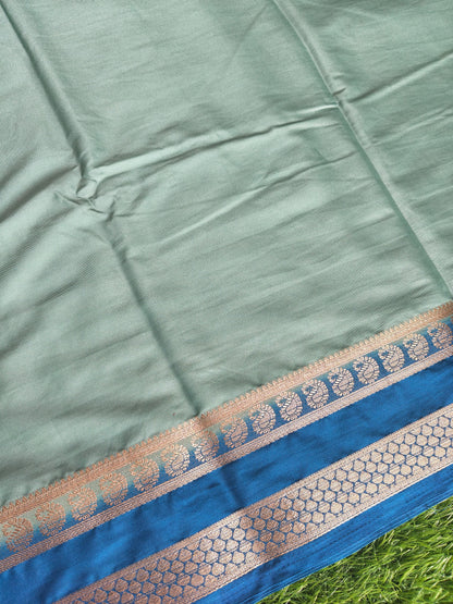Light green colour semi crepe solid colour with slim contrast border